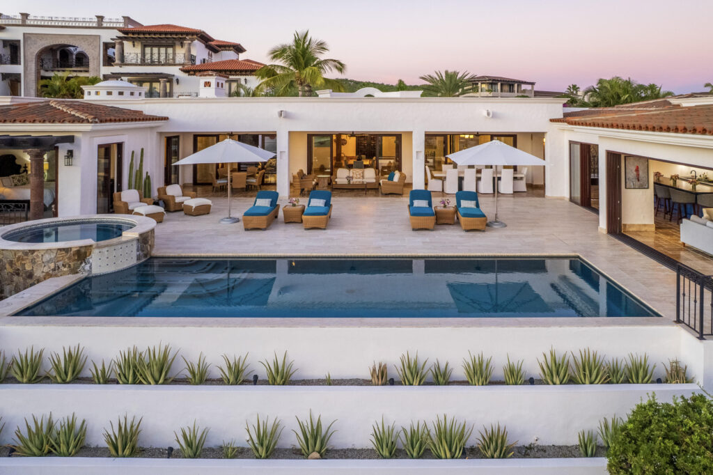 Cabo Luxury Fundadores Fully remodeled with entertaining in mind, Casa Reino is a stunning Spanish Colonial-style residence located within the double-gated Fundadores community of Puerto Los Cabos. Designed for hosting extended family and friends while maintaining exceptional privacy, this custom-built home blends timeless architecture with modern luxury and efficiency.An expansive pool terrace invites relaxed lounging under the renowned Los Cabos sunshine, complemented by shaded outdoor living and dining areas and multiple interior courtyards that provide privacy for guest suites. A brand-new bar, media, and entertainment room creates the perfect setting for dinner parties and special events.The thoughtful floor plan features a luxurious master suite with soaking tub and indoor/outdoor shower, along with four private guest suites, each positioned for comfort and seclusion. Modern upgrades throughout the home include all-new plumbing, air conditioning, doors, windows, lighting, and furnishings.Designed for efficiency and convenience, Casa Reino is equipped with a solar system, solar pool heater/chiller, and solar heat pump, keeping operating costs low. Additional highlights include an oversized two-car garage with commercial refrigerator and freezer, a new laundry room with dual washer/dryer sets, and a new BBQ cook center with wet bar, icemaker, and refrigeration. The pool has been newly refinished, exterior travertine decking installed, and a complete hurricane shutter system added.Residents of Puerto Los Cabos enjoy 27 holes of Nicklaus and Norman signature golf, with the option to transfer a golf membership at the purchaser's cost. Membership also includes access to tennis and pickleball courts. Fundadores HOA fees include exclusive access to the Fundadores Beach Club, featuring an oceanfront infinity pool, Jacuzzi, fitness center, event lawn, restaurant, and spa services.Ideally located just 5 minutes from the Puerto Los Cabos Marina, 10 minutes from downtown San José del Cabo, and 30 minutes from Los Cabos International Airport, Casa Reino offers effortless access to world-class dining, shopping, and lifestyle amenities.Special Features & UpgradesSolar system in placeSolar pool heater and chillerNewly remodeled pool with new finishesNew exterior travertine deckingNew bar / media / family roomNew laundry room with double washer & dryersNew air conditioning throughoutNew furnishingsNew kitchen appliances: refrigerator, two dishwashers, ice maker, beverage fridge & drawersNew sinks and faucets in kitchenSonos sound systemNew doors and windowsNew hurricane protection systemNew interior and exterior lightingCommercial refrigerator and freezer in garageNew countertops and cabinetry in kitchenette and bath at Guest Casita #4 – 218 Padre Piccolo, San Jose del Cabo, BS