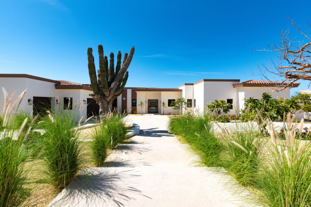 Cabo Luxury Sunset Hill Setting a new benchmark for modern design at Diamante, this truly exceptional five-bedroom, five-bathroom residence embodies the pinnacle of contemporary luxury. With an elevated aesthetic, the home utilizes state-of-the-art 3D foam panel construction to ensure remarkable environmental comfort, structural durability, and minimal long-term maintenance. Outfitted with a professional-grade suite of Wolf, Sub-Zero, and Zephyr appliances, the interior is a fully realized, turn-key masterpiece offering immediate access to the exclusive Diamante lifestyle. The open-concept living spaces are defined by a seamless indoor-outdoor flow, drawing the eye toward breathtaking sunset – 29 Boulevard Diamante, Pacific, BS