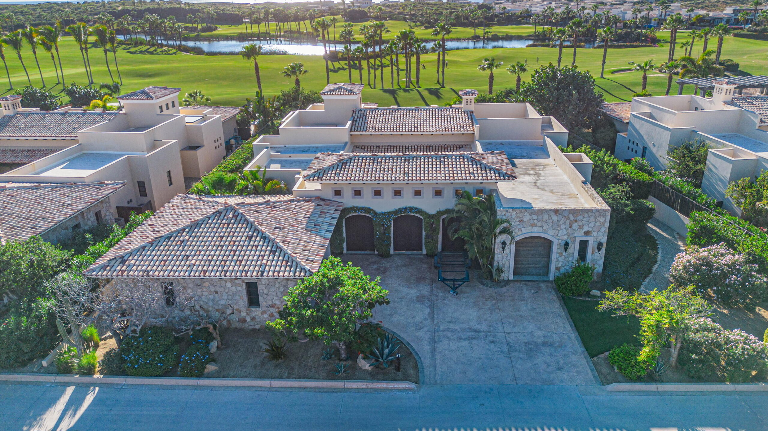 Cabo Luxury Golf Villas Set along the lush Bermuda fairways of the Tiger Woods-designed Oasis Short Course, this exceptional five-bedroom hacienda-style residence blends classic Mexican architecture with refined contemporary luxury. A grand central courtyard opens to an expansive great room that flows seamlessly to a private terrace with heated pool, palapa swim-up bar, and fire-pit lounge overlooking the Oasis par-three course. Designed for effortless entertaining, the home features multiple indoor and outdoor living spaces, a gourmet kitchen, and a covered outdoor grill ideal for hosting family and friends. As a Legacy Club home at Diamante Cabo San Lucas, ownership provides access to championship golf, the iconic Crystal Lagoon®, spa, beach club dining, and miles of Pacific coastline. for sale