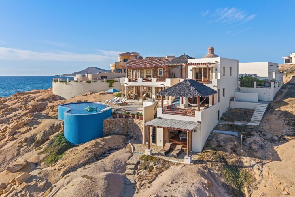 Cabo Luxury Rancholasmargaritas Casa Playa Escondida - Oceanfront Luxury in Baja California SurPerched dramatically on the rocks above the Pacific Ocean, Casa Playa Escondida is a rare oceanfront retreat set along a secluded, pristine stretch of beach. Located within the exclusive off-grid gated community of Rancho Las Margaritas, this one-of-a-kind property offers privacy, tranquility, and breathtaking natural beauty--just a 20-minute drive to the dining and shopping of Cabo San Lucas, 40 minutes from Los Cabos International Airport, and approximately 30 minutes south of Cerritos and Todos Santos.The residence features three spacious ensuite bedrooms, each privately situated yet connected by terraces, pathways, and shared gathering spaces. A dedicated media room offers flexibility as a fourth bedroom or additional guest suite.Expansive terraces and multiple lounging areas provide a variety of vantage points to take in the surrounding landscape, from the rugged coastline to the endless Pacific horizon.The gourmet kitchen is equipped with high-end appliances and designed for both functionality and style. A warm and inviting living and dining area, anchored by a striking fireplace, creates the perfect space for entertaining or relaxing with family and friends. The home is offered fully furnished with includes modern off-grid conveniences such as solar power.Outdoor living is equally exceptional, featuring a swimming pool, firepit, grilling area, and multiple seating spaces--ideal for enjoying the serene coastal setting – 75 Avenue de Marlin, Pacific, BS