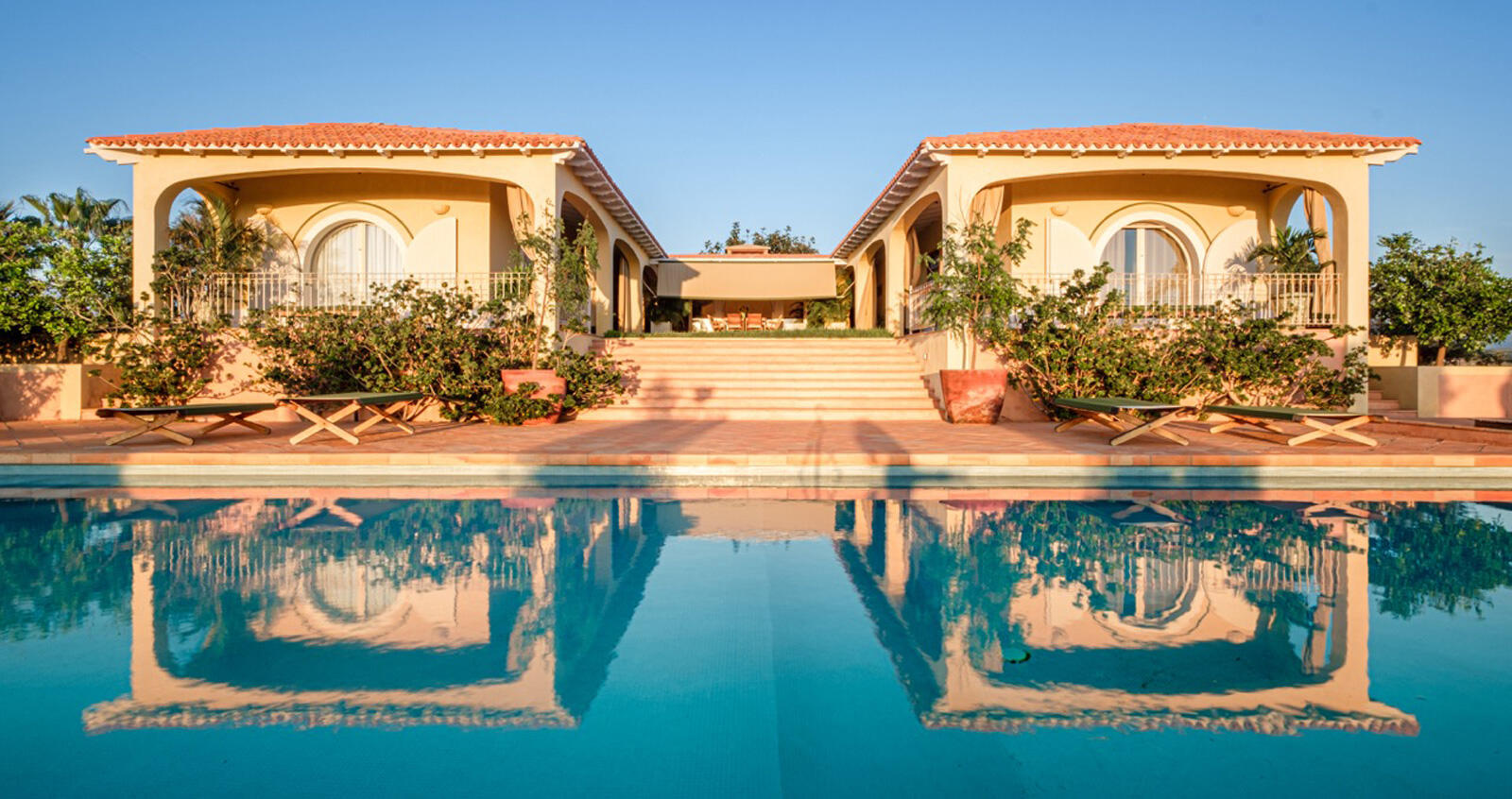 Cabo Luxury Todos Santos-General Iconic Mediterranean-style residence nestled in the desert of Baja California Sur. This estate is perfectly suited for a private full-time residence, high-end boutique hotel, luxury vacation rental, or exclusive destination venue. Built to the highest standards, the mansion features double-glazed windows and marine mahogany doors imported from Europe. The interior combines international quality with Mexican craftsmanship, including handmade Saltillo-style mosaics throughout. The gourmet kitchen, equipped with designer appliances and handcrafted tiles, flows seamlessly into a great room and a terrace offering limitless for sale