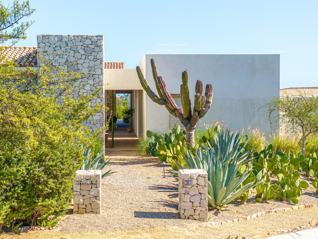 Cabo Luxury Oasis Palmilla Set on a rare oversized lot within Oasis Palmilla, this single-level hacienda-style residence offers exceptional privacy and a true sense of desert seclusion. Surrounded by low-density landscape, the home enjoys peaceful afternoons with seamless integration with nature.The 4,792 A/C sq. ft. layout includes 4 bedrooms, 4 full baths, 1 powder room, a media room, and a separate maid's quarters, all thoughtfully arranged on one level. A charming central courtyard with mature Torote trees anchors the home, while outdoor living areas are designed for family gatherings andentertaining. Additional features include solar panels with a bidirectional meter, a spacious primary suite with a large dressing room, a bunk bedroom, a large garage, and a two-car trellis. This is the only completed built home currently available for sale in Oasis, offering immediate value in an established A-community with no remaining one-acre lots.Eligible for Club 96 membership (subject to approval and fees). – Oasis Palmilla 32, San Jose Corridor, San Jose Corridor, BS