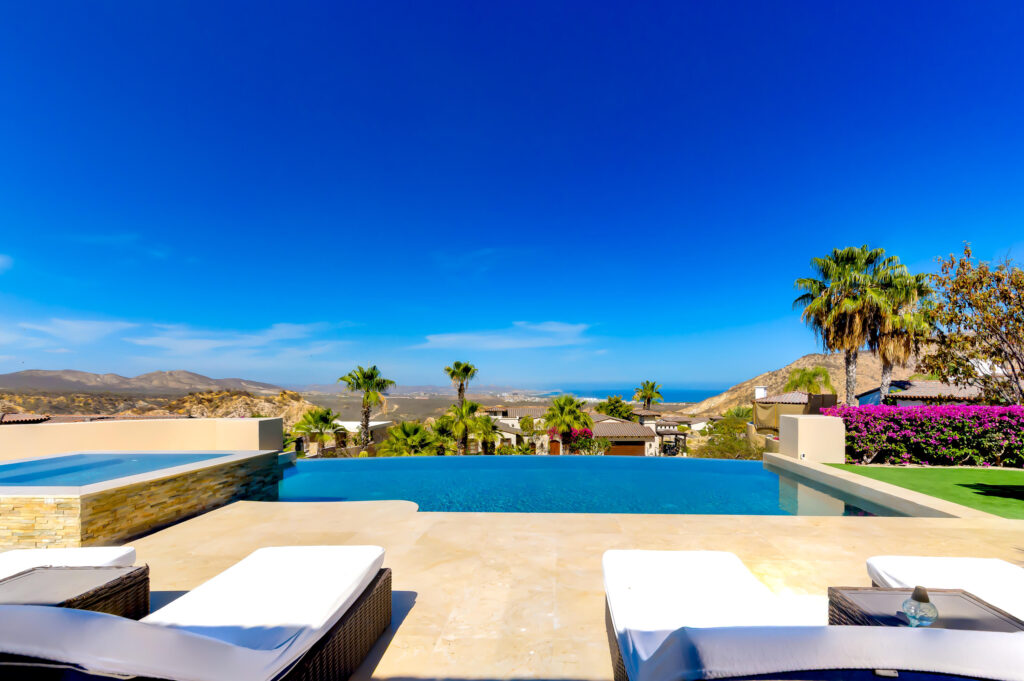 Cabo Luxury Section 4- Las Canadas Discover refined indoor-outdoor living at Cañada 9, set within Querencia, San Jose del Cabo's premier private golf community. Soaring beamed ceilings, walls of pocket glass, and luminous marble floors define an open great room that flows effortlessly to the terrace, infinity-edge pool, and stone-clad water feature -- all framed by panoramic Sea of Cortez and mountain – Querencia Golf and Ocean Club, San Jose Corridor, BS
