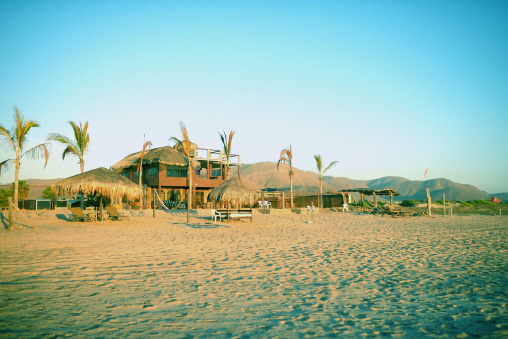 Cabo Luxury Cerritos For sale: A remarkable property in South Cerritos Beach. Spanning an impressive 3,470 m2, this lot includes two buildings with eight units, each adorned with traditional palapa roofs. The owner has meticulously prepared and enhanced the land, creating a level and expansive area extending towards the beachfront. This unique offering presents limitless potential, suitable for a family compound. The property is entirely self-sustaining, equipped with solar panels, water cistern, and septic systems, ensuring a harmonious blend with its natural surroundings. Located just 1.5 miles from the main surf break and in close proximity to local restaurants, this is an exceptional opportunity for those seeking a blend of tranquility and accessibility. – South Cerritos, Pacific, BS